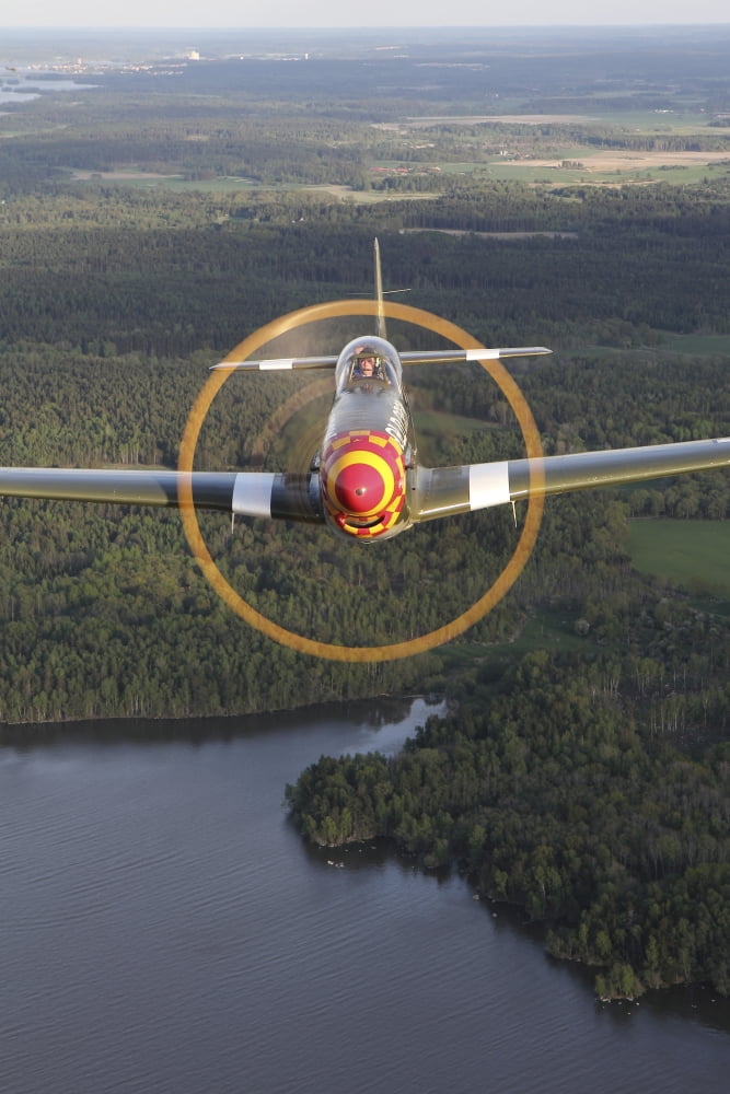 A North American P-51 Mustang in flight over Vasteras Sweden Canvas Art - Daniel KarlssonStocktrek Images (12 x 18)