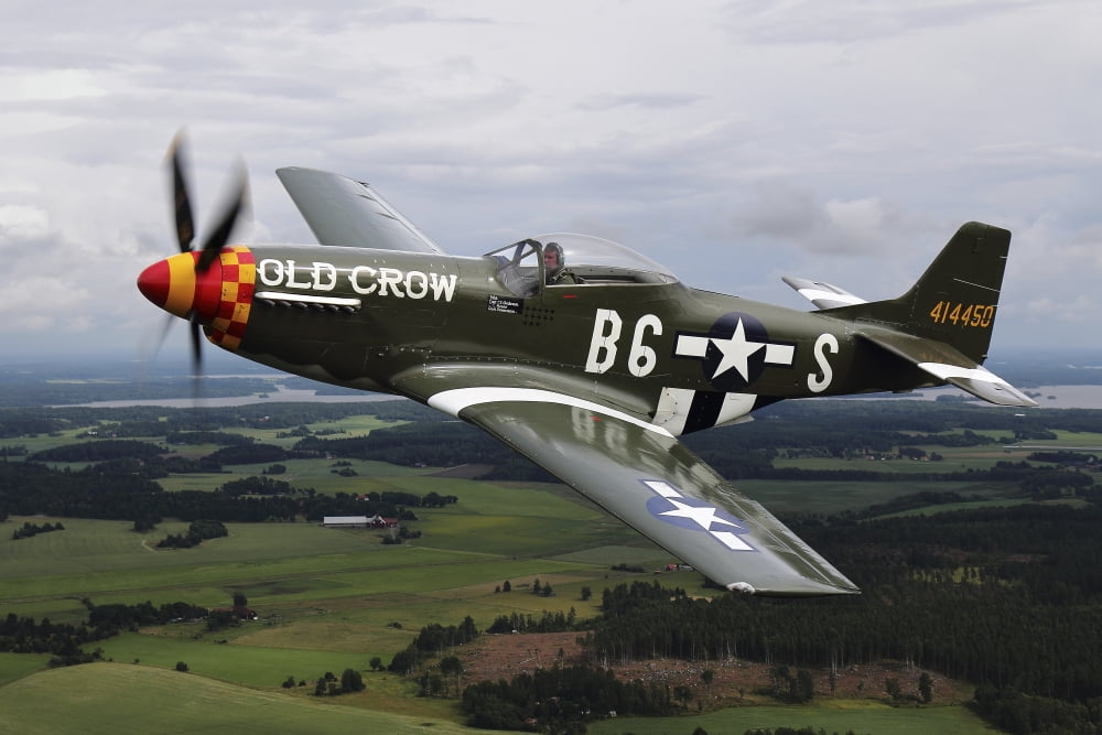 A North American P-51 Mustang in flight over Vasteras Sweden Canvas Art - Daniel KarlssonStocktrek Images (18 x 12)