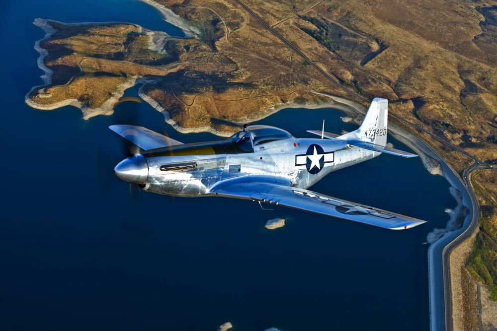 A North American P-51D Mustang flying near Chino California Canvas Art - Scott GermainStocktrek Images (35 x 23)