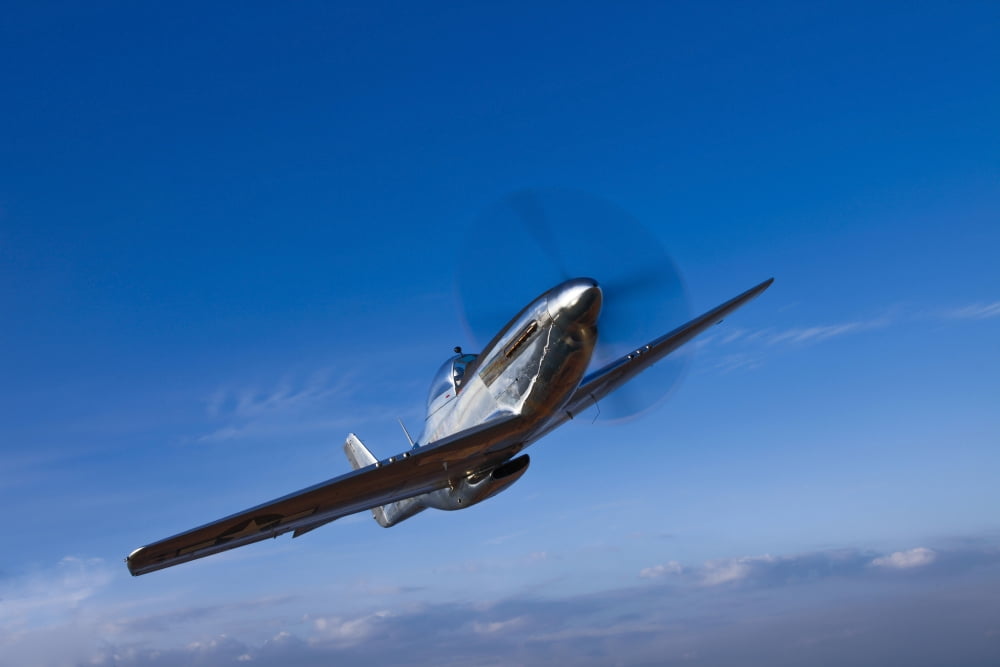 A North American P-51D Mustang in flight near Chino California Canvas Art - Scott GermainStocktrek Images (18 x 12)