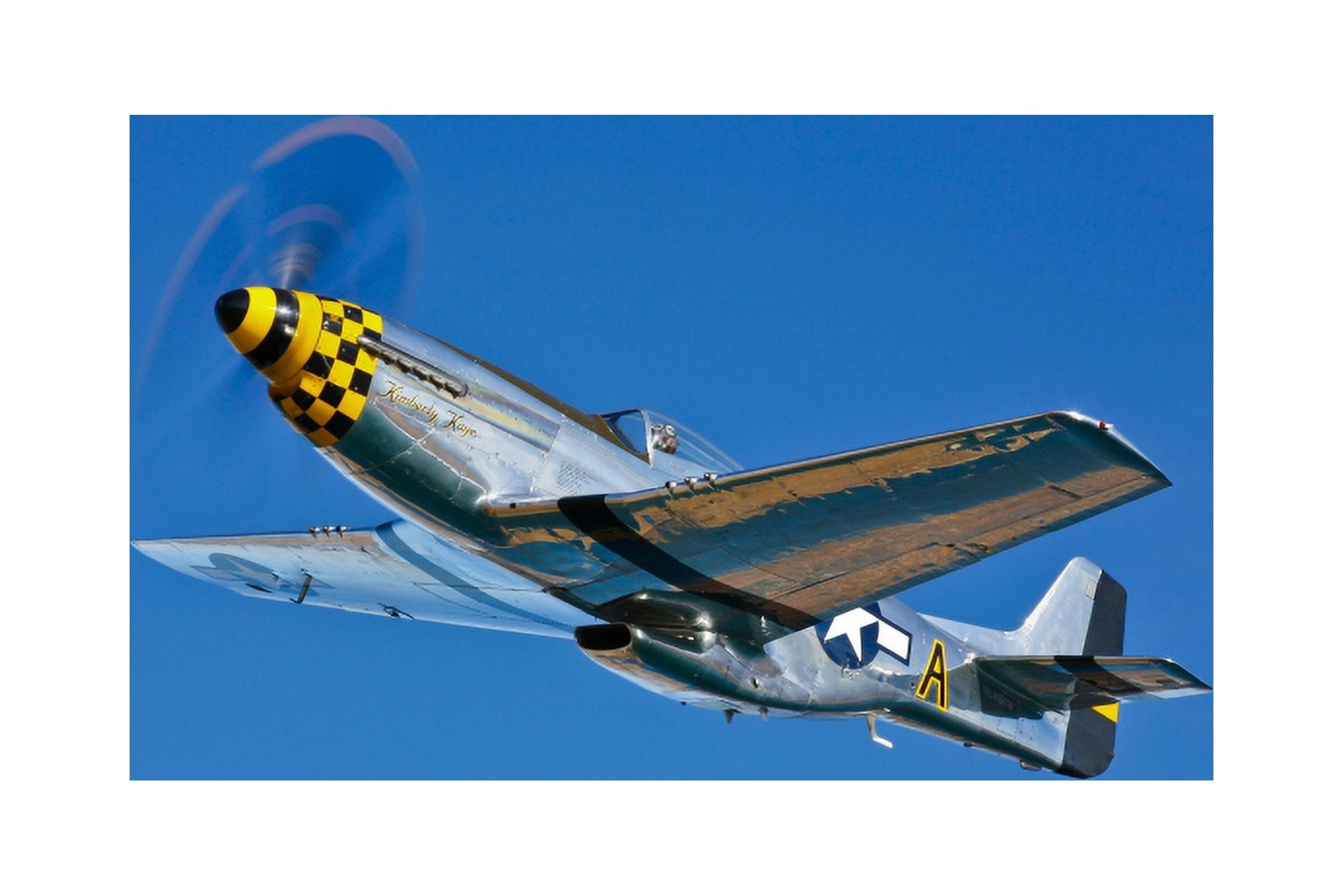 A North American P-51D Mustang in flight near Chino California Canvas Art - Scott GermainStocktrek Images (18 x 12)