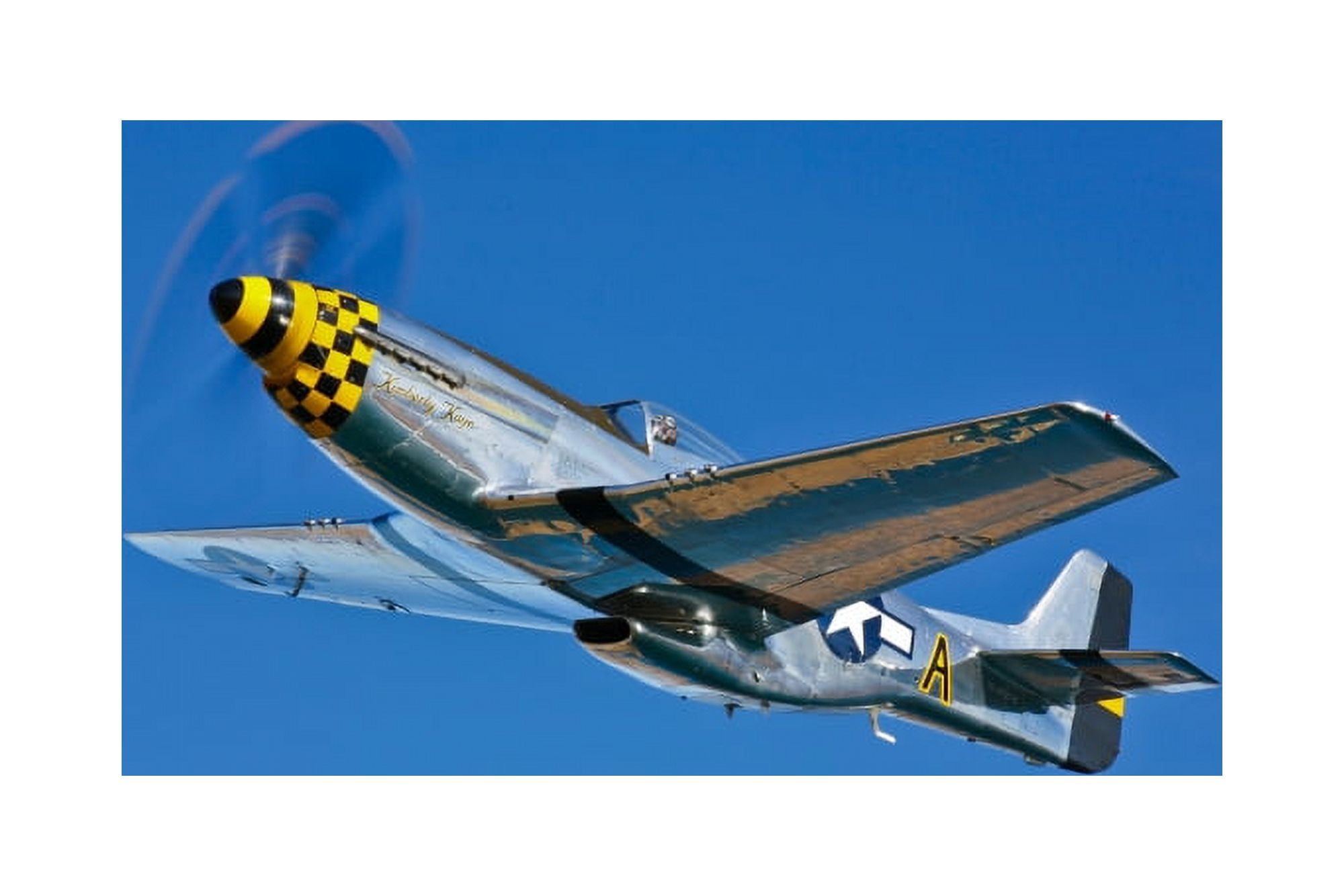 A North American P-51D Mustang in flight near Chino California Canvas Art - Scott GermainStocktrek Images (35 x 23)