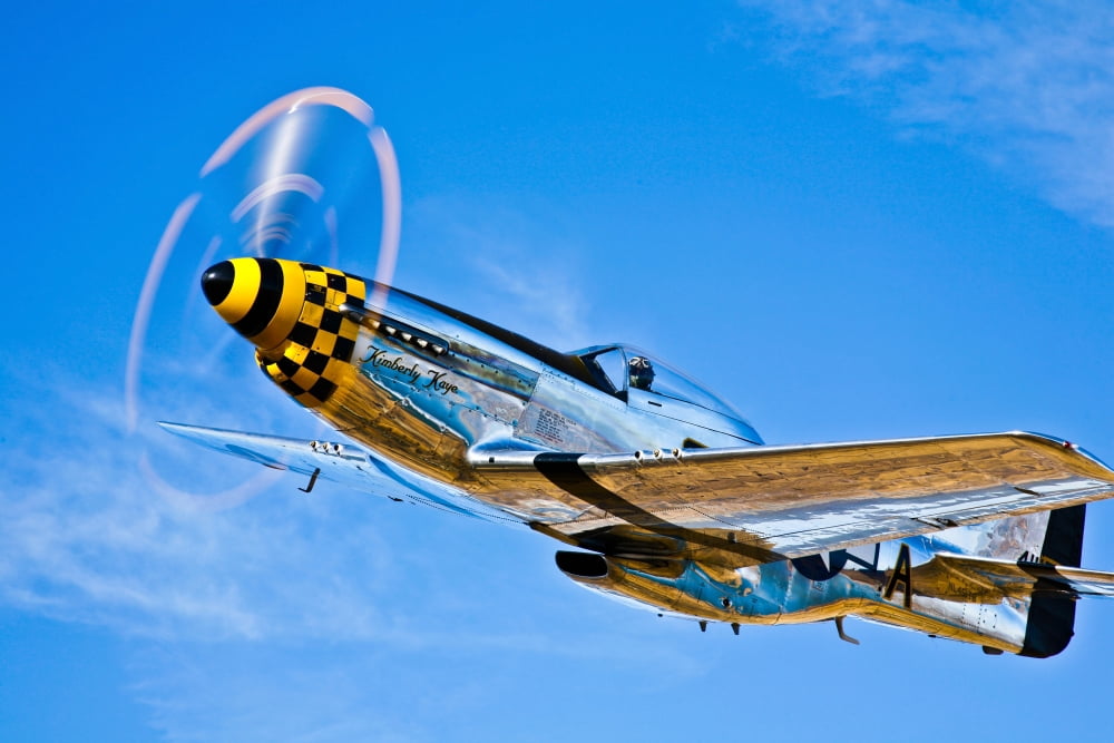 A North American P-51D Mustang in flight near Chino California Canvas Art - Scott GermainStocktrek Images (35 x 23)