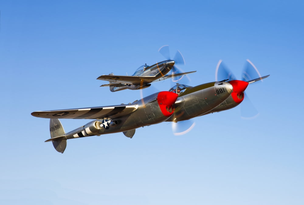 A P-38 Lightning and P-51D Mustang in flight Canvas Art - Scott GermainStocktrek Images (34 x 23)