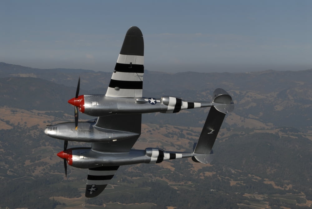 A P-38 Lightning in flight over Santa Rosa California Canvas Art - Phil WallickStocktrek Images (17 x 12)