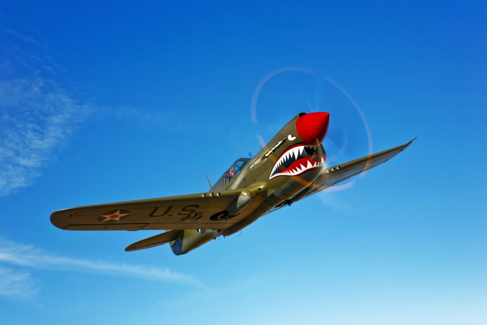 A P-40E Warhawk in flight Canvas Art - Scott GermainStocktrek Images (18 x 12)