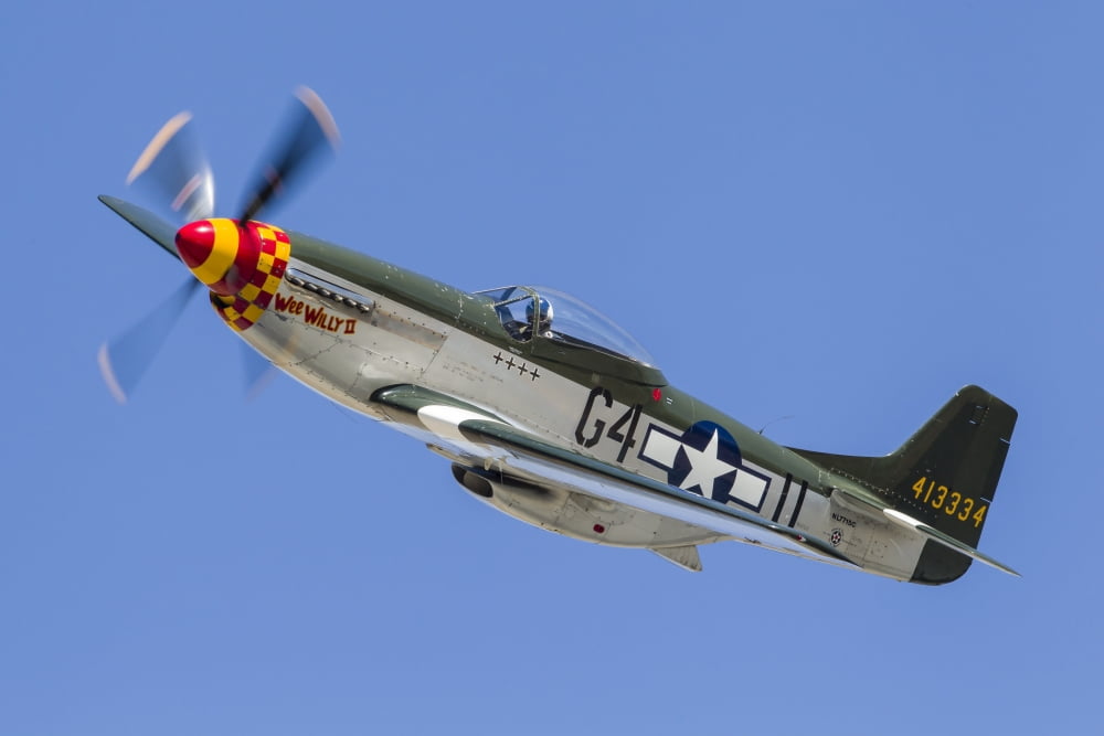 A P-51 Mustang flies by at Stead Field Nevada Canvas Art - Rob EdgcumbeStocktrek Images (17 x 12)