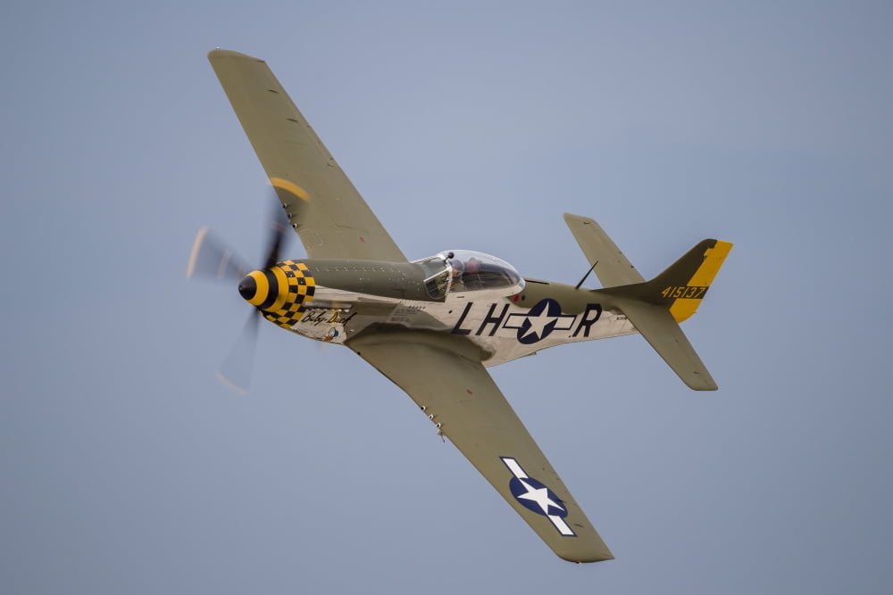 A P-51 Mustang flies by at Waukegan Illinois Canvas Art - Rob EdgcumbeStocktrek Images (34 x 23)