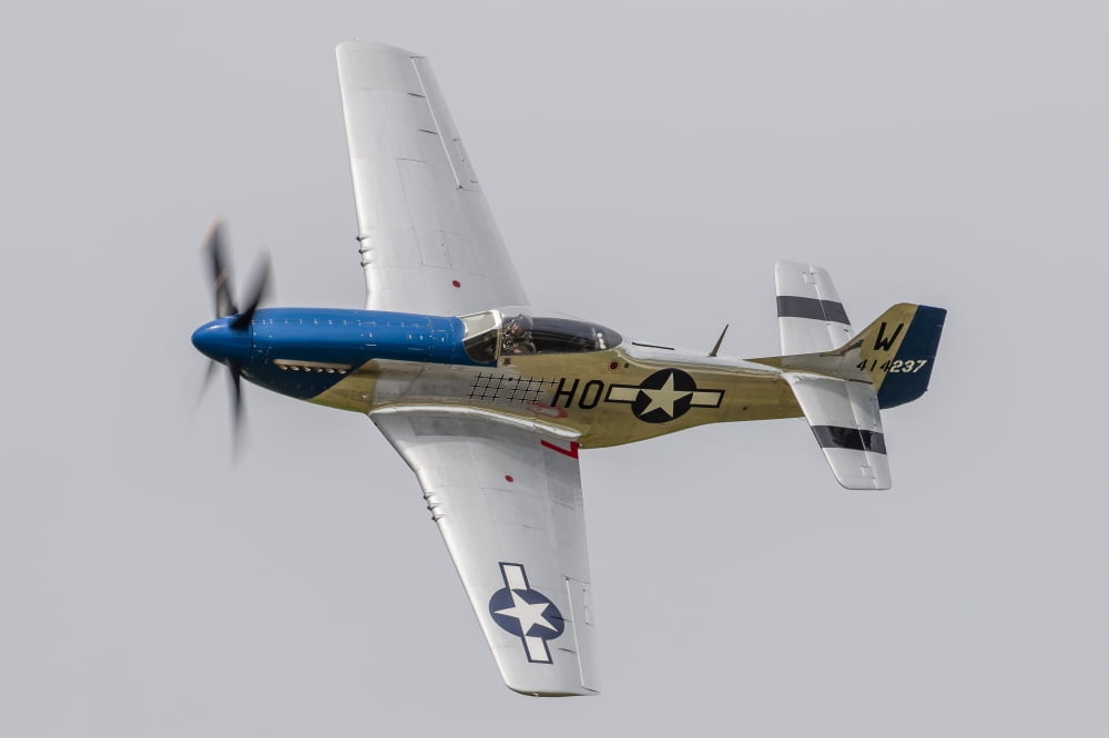 A P-51 Mustang flies by at Waukegan Illinois Canvas Art - Rob EdgcumbeStocktrek Images (34 x 23)