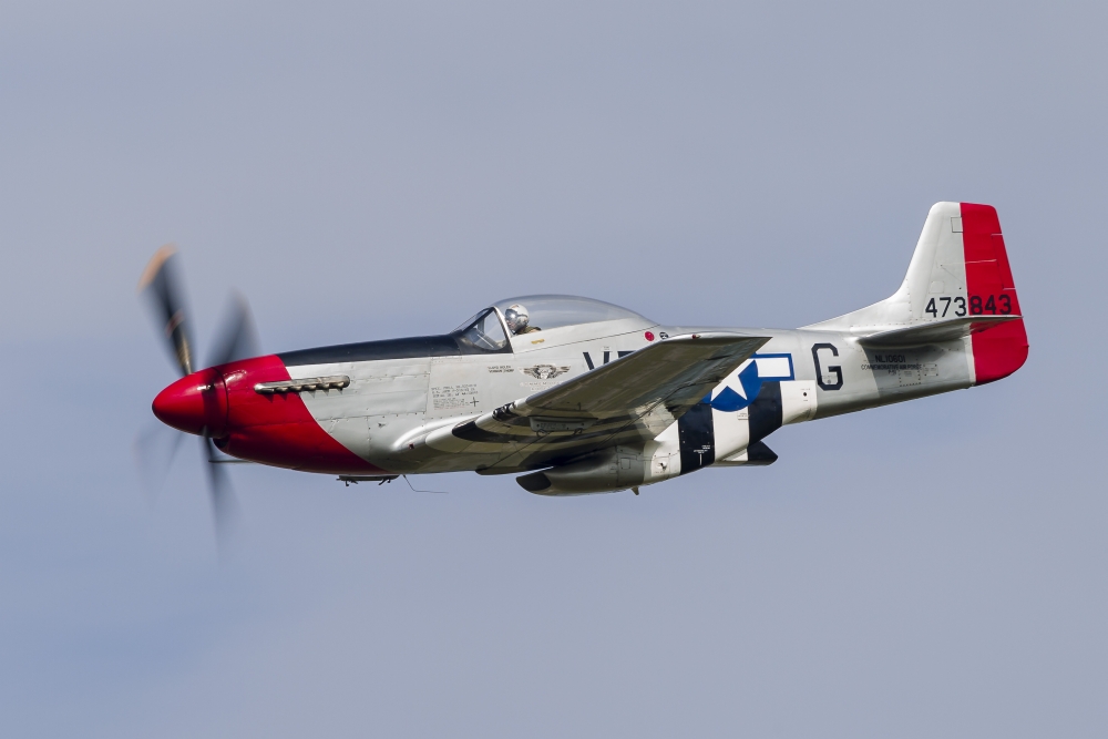 A P-51 Mustang flies by at Willow Run Michigan Canvas Art - Rob EdgcumbeStocktrek Images (17 x 12)