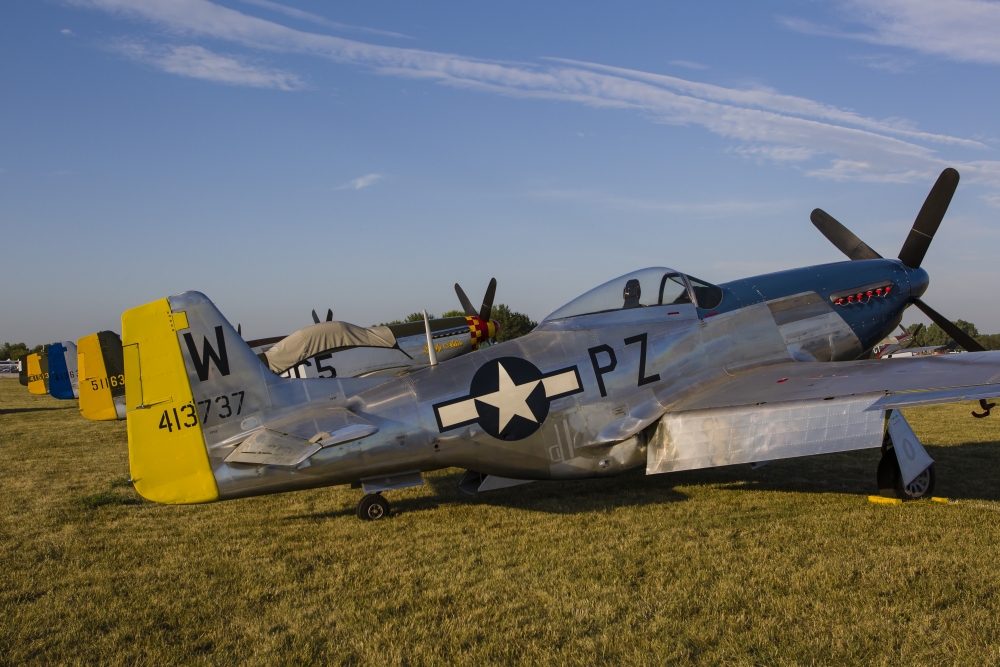 A P-51 Mustang parked at EAA Airventure Oshkosh Wisconsin Canvas Art - Rob EdgcumbeStocktrek Images (34 x 23)
