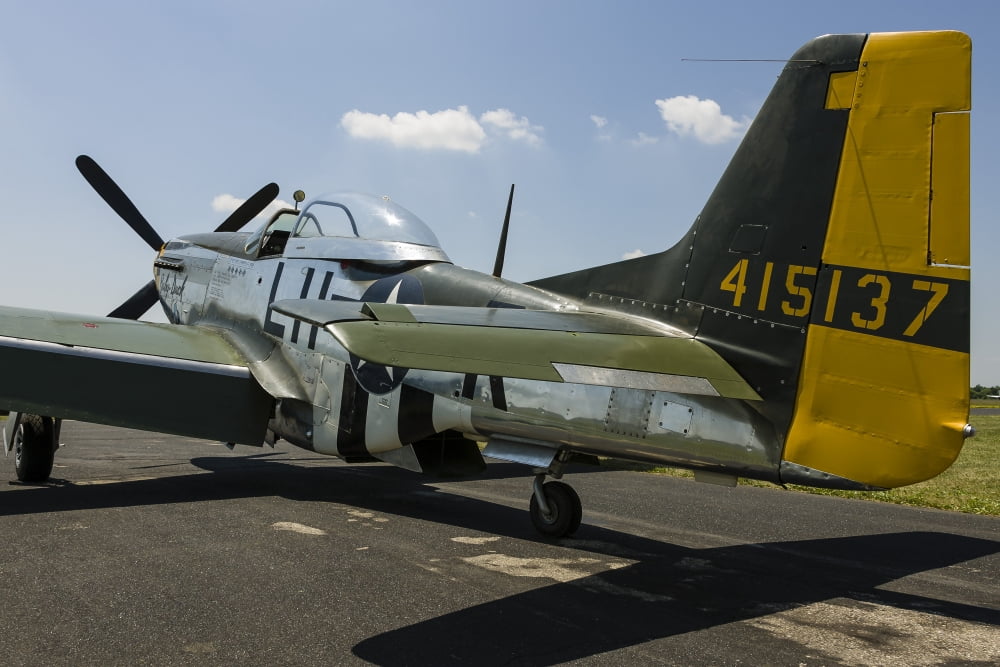 A P-51 Mustang parked on the ramp at East Troy Wisconsin Canvas Art - Rob EdgcumbeStocktrek Images (17 x 12)