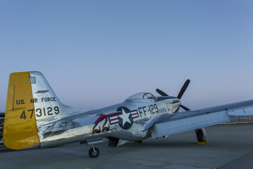 A P-51 Mustang parked on the ramp at Livermore California Canvas Art - Rob EdgcumbeStocktrek Images (34 x 23)