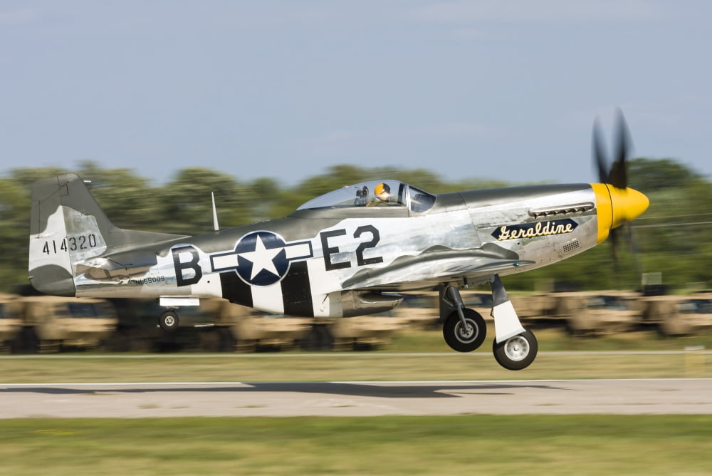 A P-51 Mustang takes off from Oshkosh Wisconsin Canvas Art - Rob EdgcumbeStocktrek Images (17 x 12)
