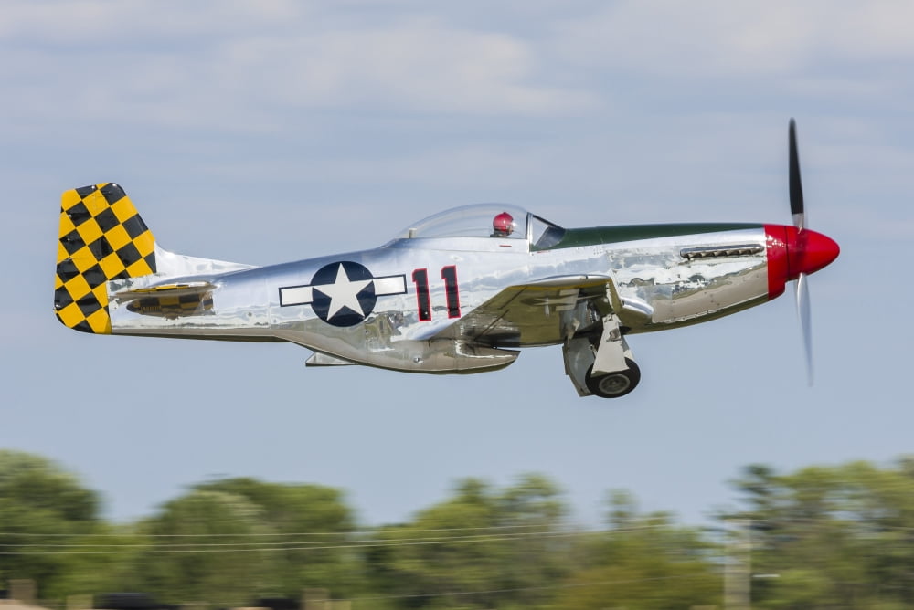 A P-51 Mustang takes off from Oshkosh Wisconsin Canvas Art - Rob EdgcumbeStocktrek Images (34 x 23)