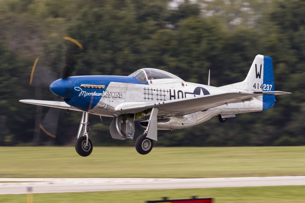 A P-51 Mustang takes off from Waukegan Illinois Canvas Art - Rob EdgcumbeStocktrek Images (34 x 23)