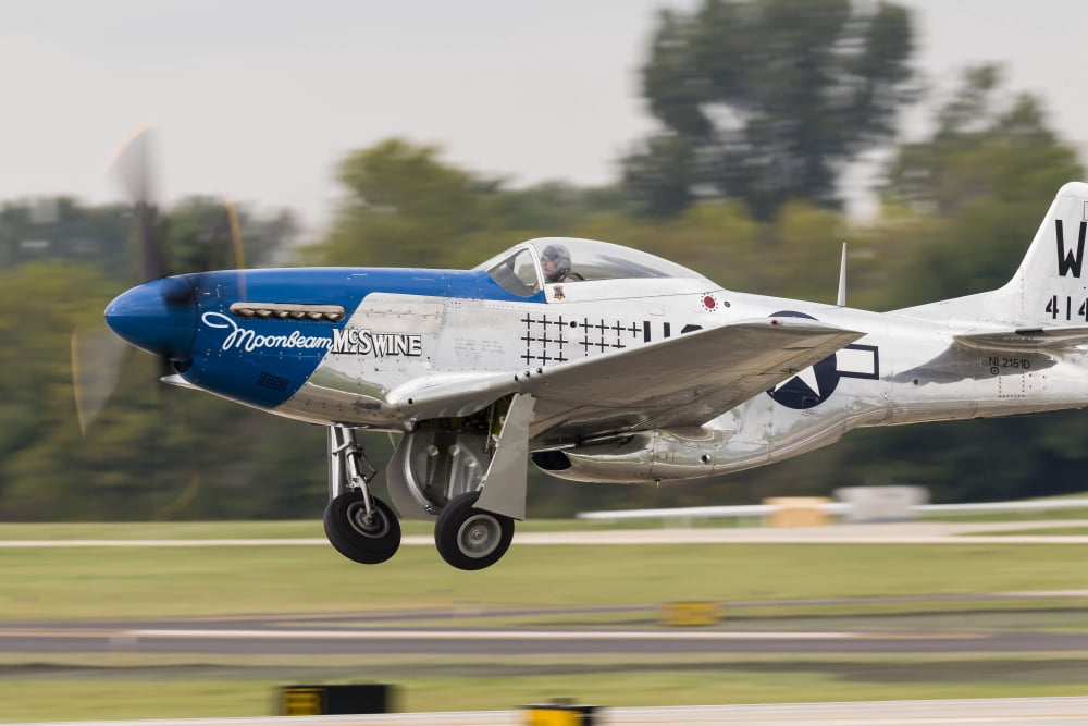 A P-51 Mustang takes off from Waukegan Illinois Canvas Art - Rob EdgcumbeStocktrek Images (34 x 23)