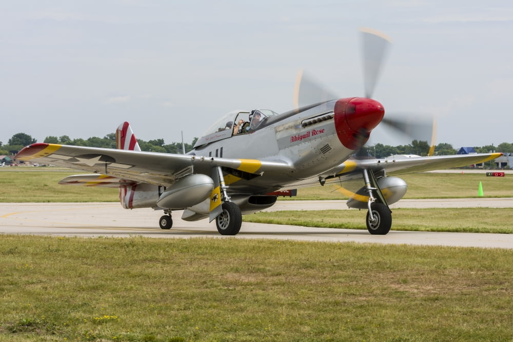 A P-51 Mustang taxiing at Oshkosh Wisconsin Canvas Art - Rob EdgcumbeStocktrek Images (34 x 23)