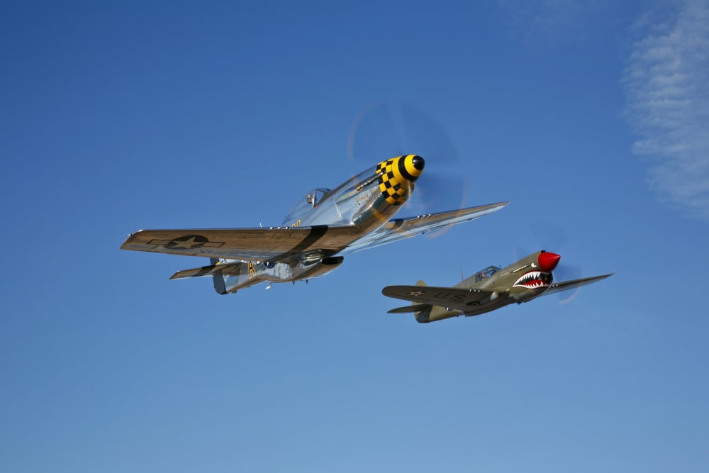 A P-51D Mustang Kimberly Kaye and a P-40E Warhawk in flight Canvas Art - Scott GermainStocktrek Images (35 x 23)