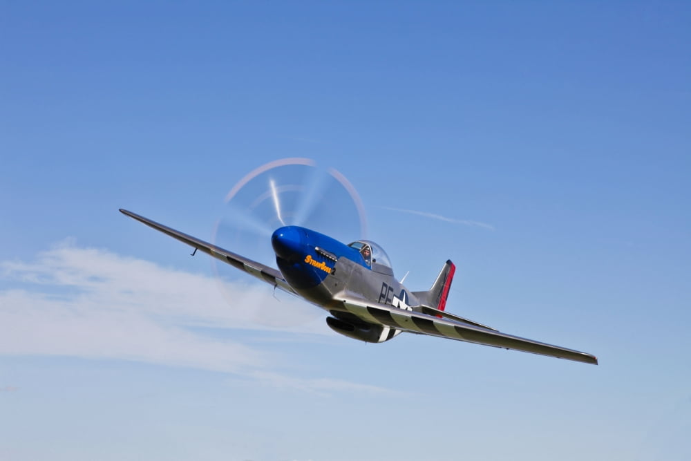A P-51D Mustang in flight over Hollister California Canvas Art - Scott GermainStocktrek Images (35 x 23)
