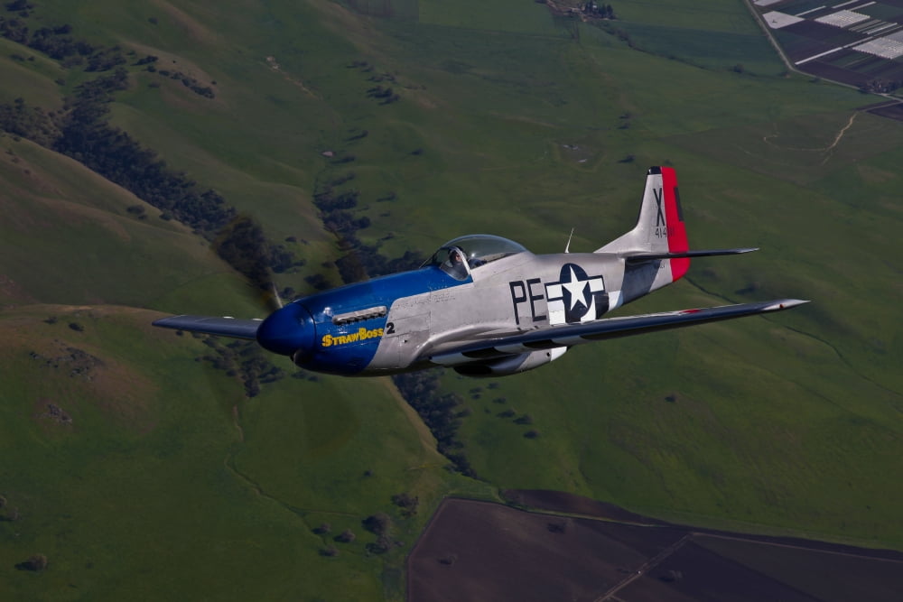 A P-51D Mustang in flight over Hollister California Canvas Art - Scott GermainStocktrek Images (35 x 23)