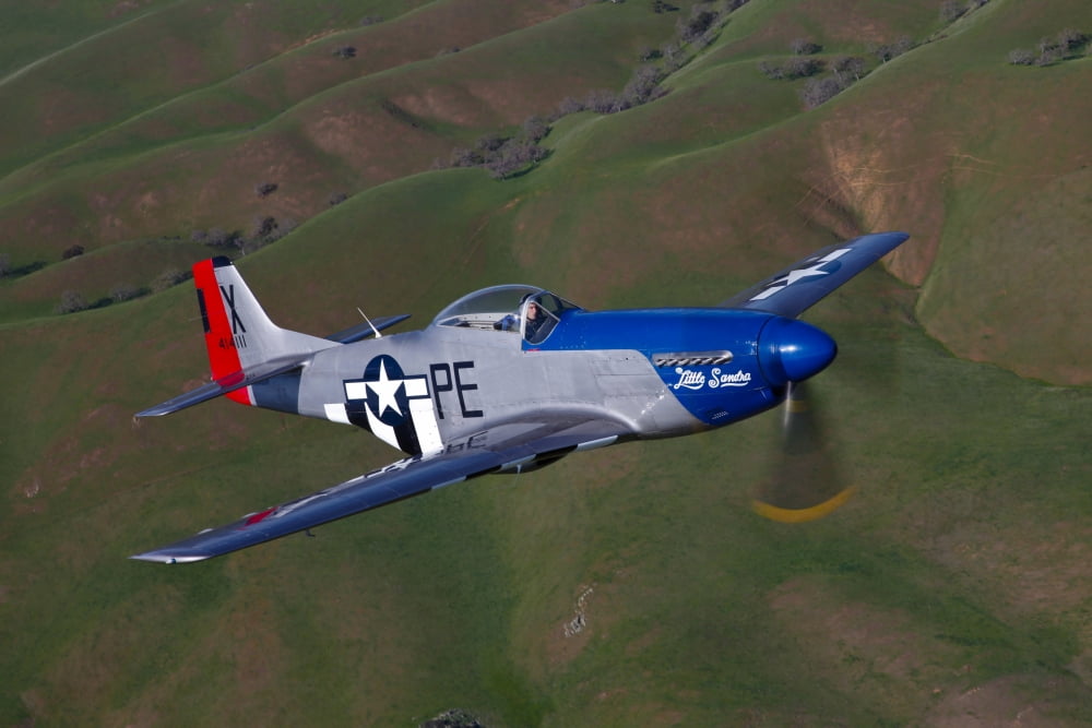 A P-51D Mustang in flight over Hollister California Canvas Art - Scott GermainStocktrek Images (35 x 23)