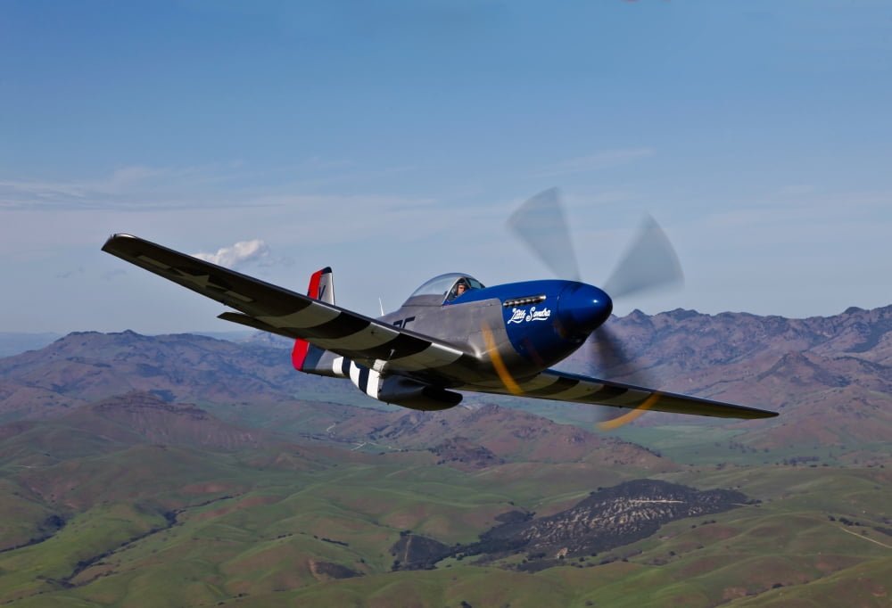 A P-51D Mustang in flight over Hollister California Canvas Art - Scott GermainStocktrek Images (35 x 24)