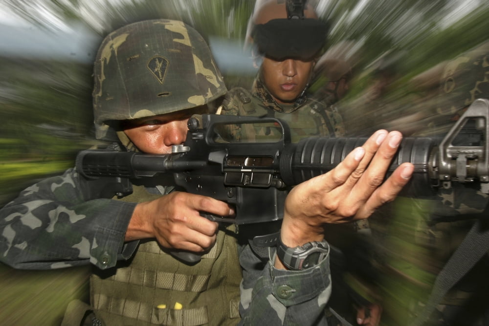 A Philippine Marine takes aim while a US Marine looks on Canvas Art - Stocktrek Images (35 x 23)