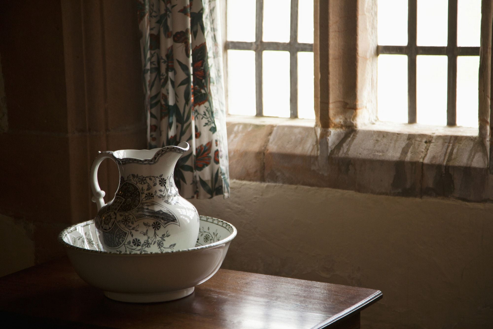 A Pitcher And Basin Sit On The Table Beside A Window Lindisfarne Northumberland England Canvas Art - John Short  Design Pics (19 x 12)