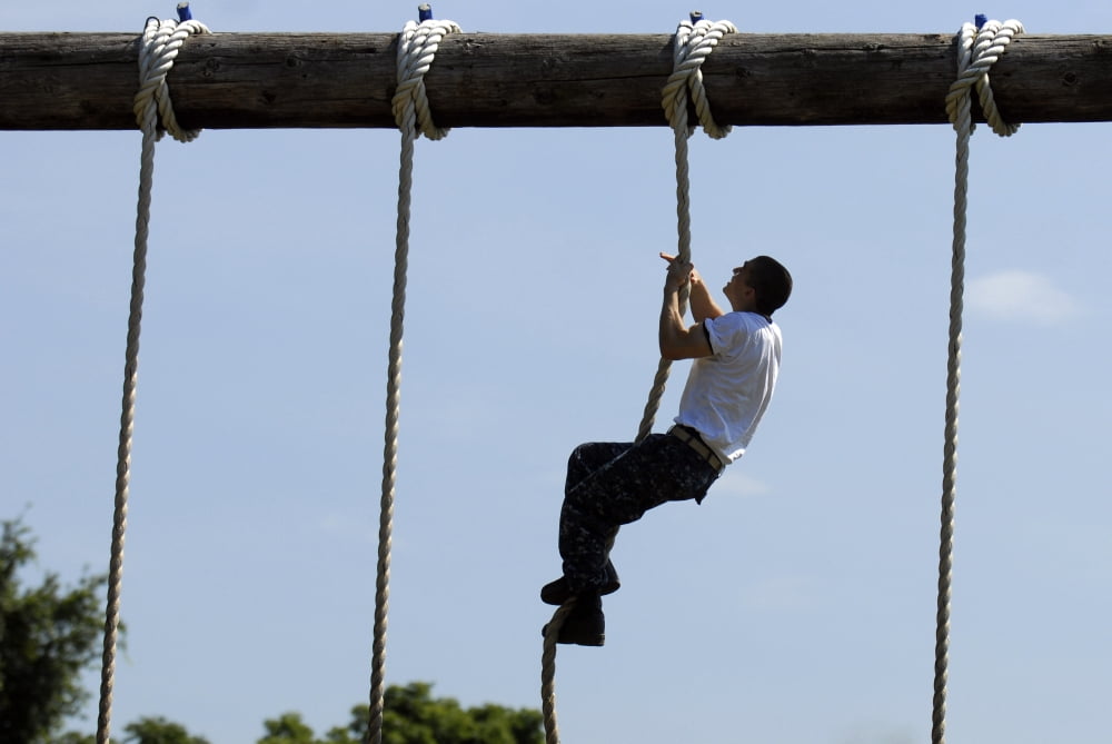 A Plebe in the US Naval Academy makes his way through the schools obstacle course Canvas Art - Stocktrek Images (35 x 23)