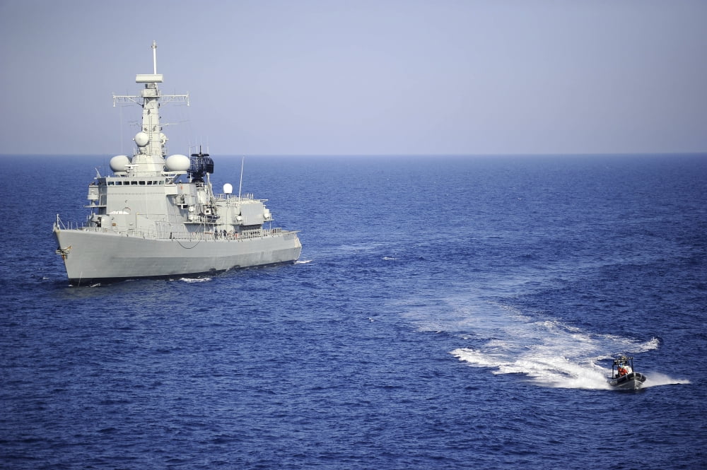 A Portuguese navy team in an inflatable boat leaves Portuguese navy frigat NRP Bartolomeu Dias Canvas Art - Stocktrek Images (34 x 23)