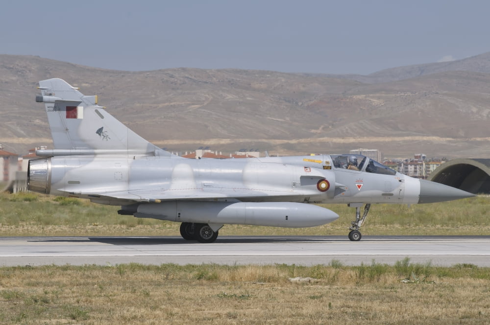 A Qatar Emiri Air Force Mirage 2000 taxiing on the runway Canvas Art - Giovanni CollaStocktrek Images (17 x 12)