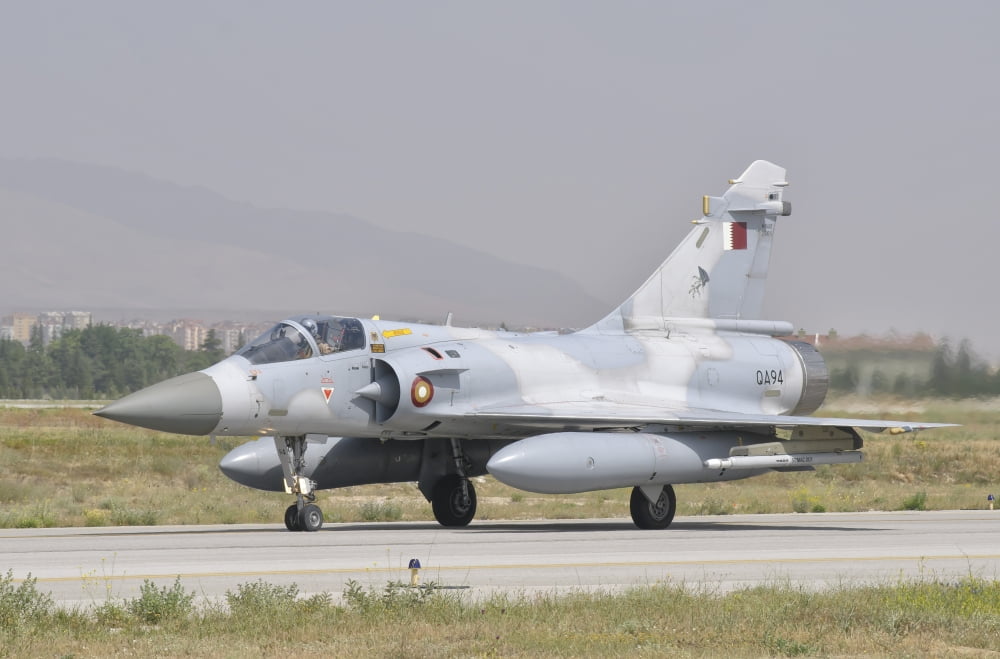 A Qatar Emiri Air Force Mirage 2000 taxiing on the runway Canvas Art - Giovanni CollaStocktrek Images (34 x 23)
