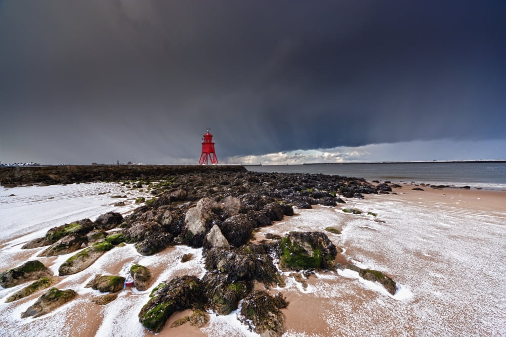 A Red Lighthouse Along The Coast Under A Stormy Sky South Shields Tyne And Wear England Canvas Art - John Short Design Pics (19 x 12)