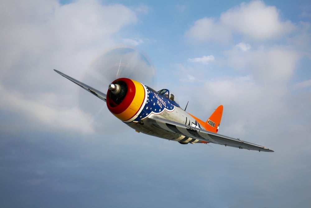 A Republic P-47D Thunderbolt in flight Canvas Art - Scott GermainStocktrek Images (35 x 23)