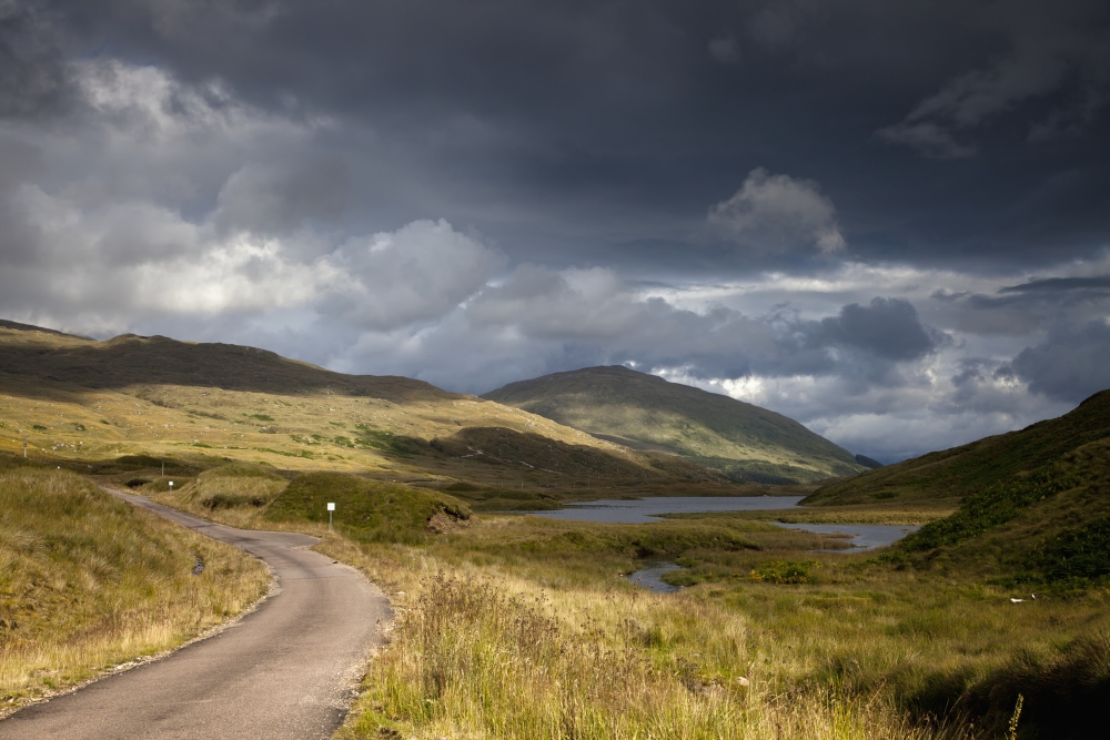 A Road Curving Through A Mountainous Landscape Ardnamurchan ArgylScotland Canvas Art - John Short Design Pics (19 x 12)