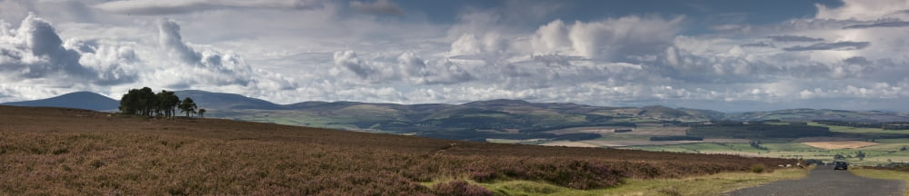 A Road Leading Into The Distance And Dramatic Clouds Over A Landscape Northumberland England Canvas Art - John Short Design Pics (44 x 10)