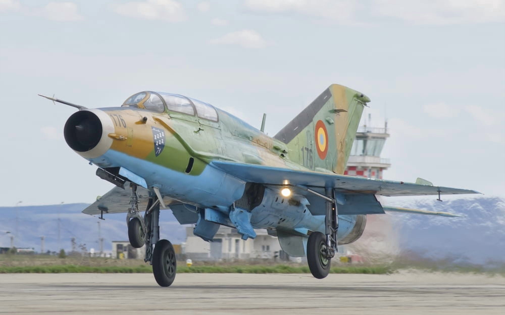 A Romanian Air Force MiG-21B taking off from Camp Turzii Air Base Romania Canvas Art - Giovanni CollaStocktrek Images (18 x 11)