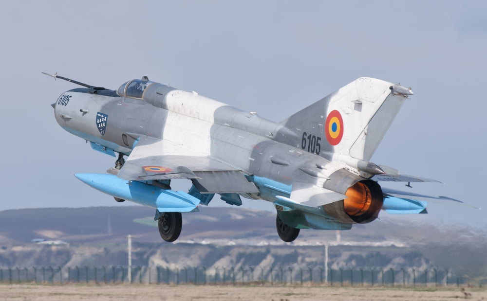 A Romanian Air Force MiG-21C taking off from Camp Turzii Air Base Romania Canvas Art - Giovanni CollaStocktrek Images (18 x 11)