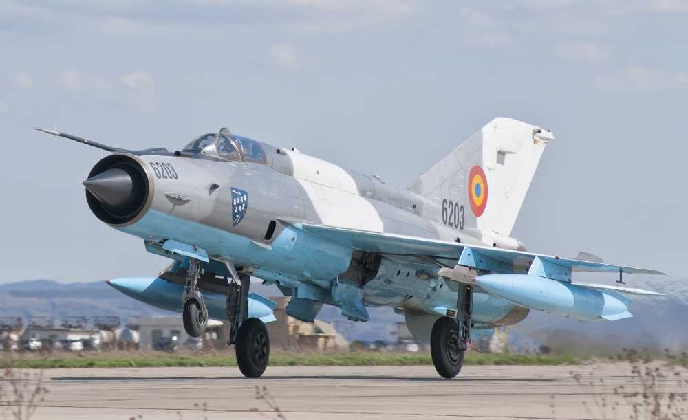 A Romanian Air Force MiG-21C taking off from Camp Turzii Air Base Romania Canvas Art - Giovanni CollaStocktrek Images (18 x 11)