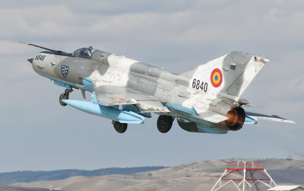 A Romanian Air Force MiG-21C taking off from Camp Turzii Air Base Romania Canvas Art - Giovanni CollaStocktrek Images (18 x 11)