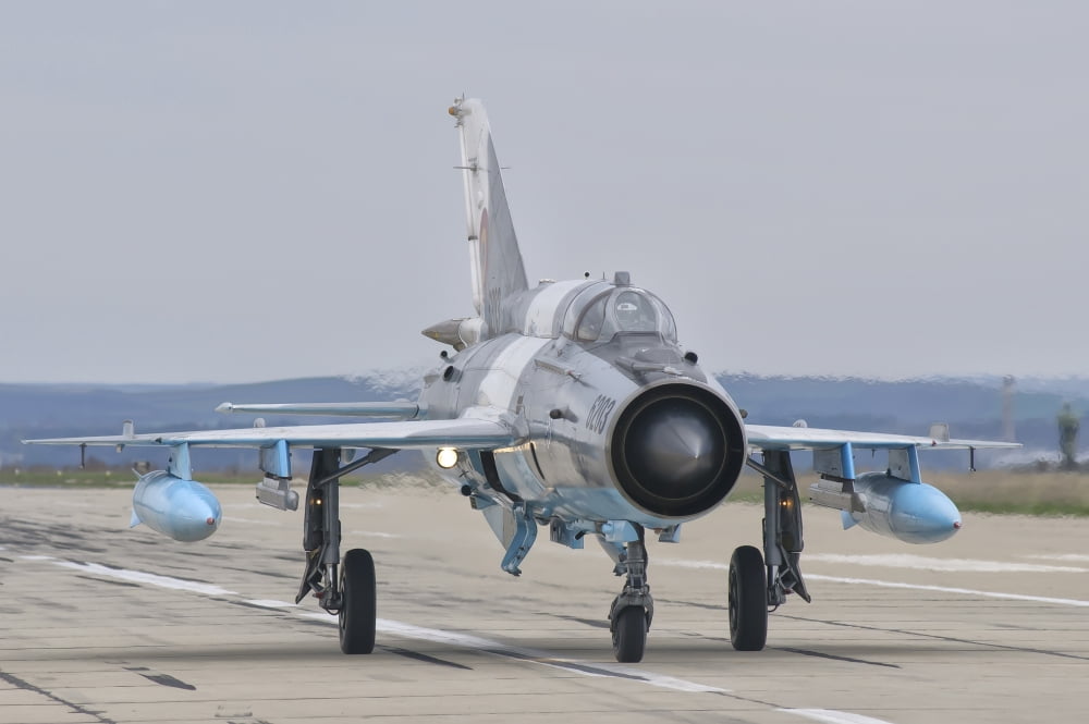 A Romanian Air Force MiG-21C taxiing at Camp Turzii Air Base Romania Canvas Art - Giovanni CollaStocktrek Images (34 x 23)