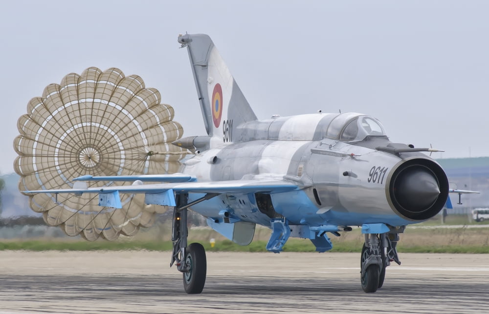 A Romanian Air Force MiG-21C with parachute deployed Canvas Art - Giovanni CollaStocktrek Images (35 x 23)
