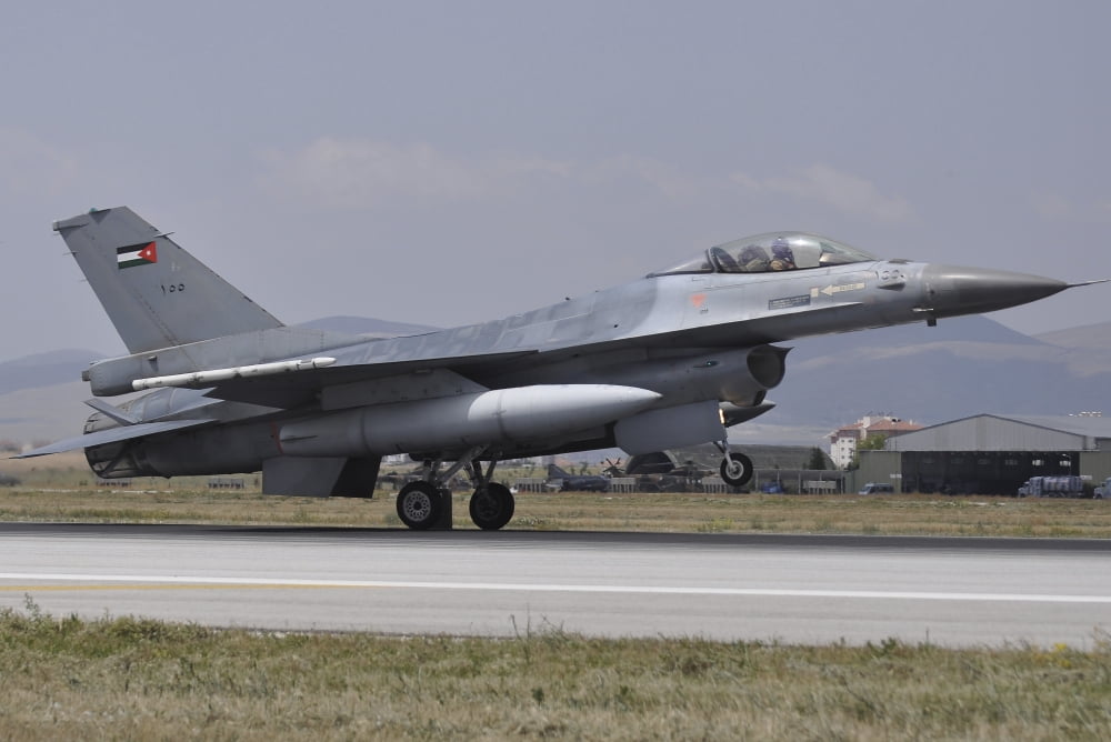 A Royal Jordanian Air Force F-16AM aircraft landing at Konya Air Base Turkey Canvas Art - Giorgio CiariniStocktrek Images (34 x 23)