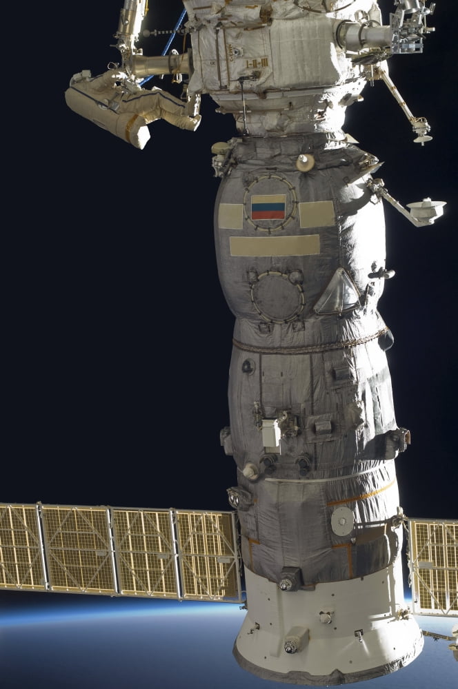 A Russian cosmonaut working on the Russian segment of the International Space Station Canvas Art - Stocktrek Images (23 x 34)