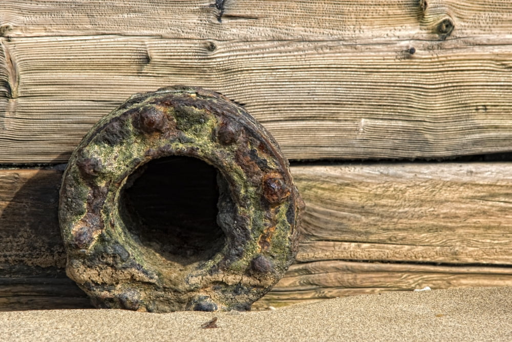 A Rusted Metal Pipe Opening Canvas Art - John Short Design Pics (34 x 22)