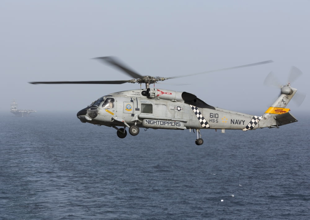 A SH-60J Seahawk during a vertical replenishment in the Arabian Sea Canvas Art - Gert KromhoutStocktrek Images (34 x 24)