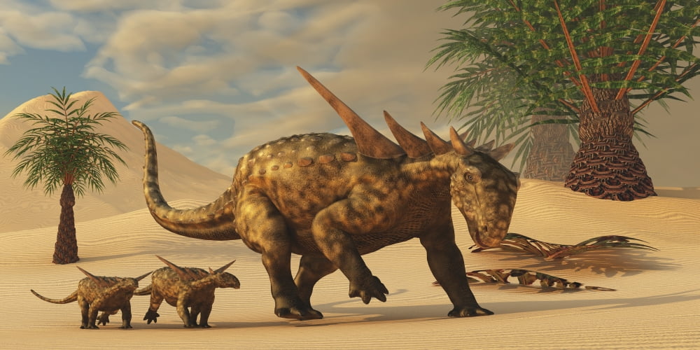 A Sauropelta mother leads her offspring in a desert area of North America Canvas Art - Corey FordStocktrek Images (40 x 20)
