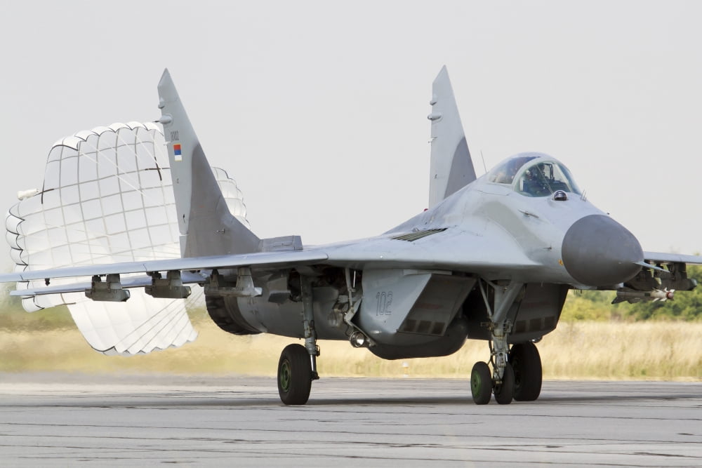 A Serbian Air Force MiG-29 with brake chute deployed Canvas Art - Anton BalakchievStocktrek Images (18 x 12)