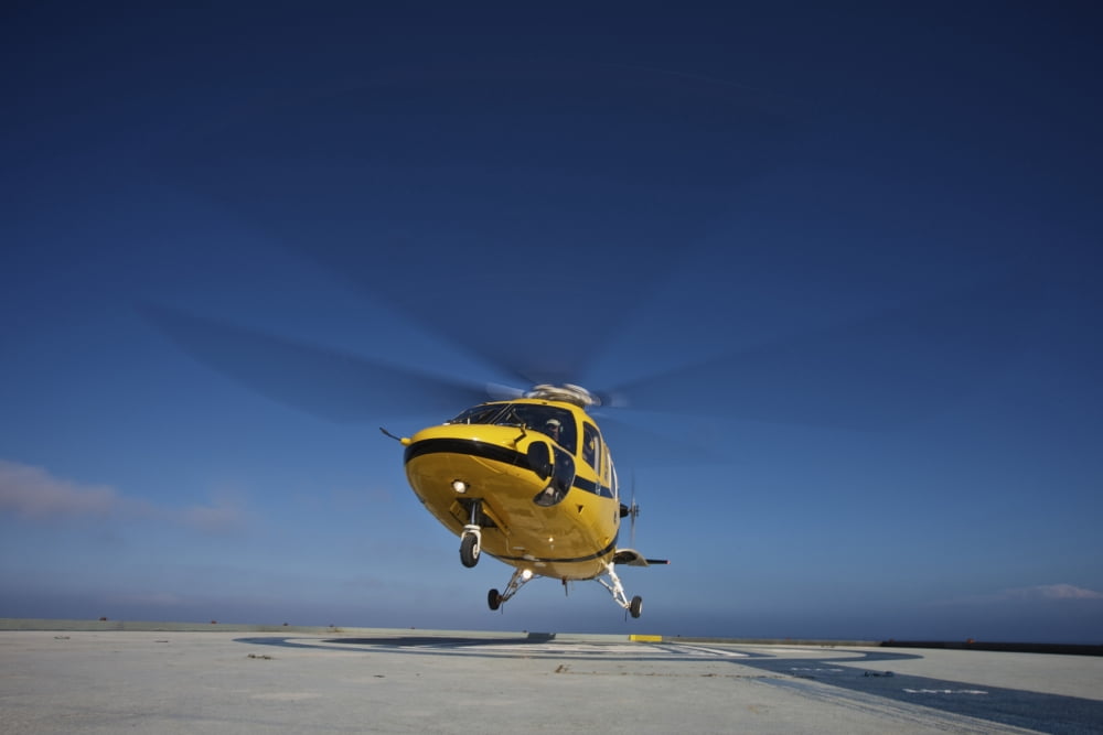 A Sikorsky S-76 utility helicopter taking off from an oil rig Canvas Art - Terry MooreStocktrek Images (17 x 12)